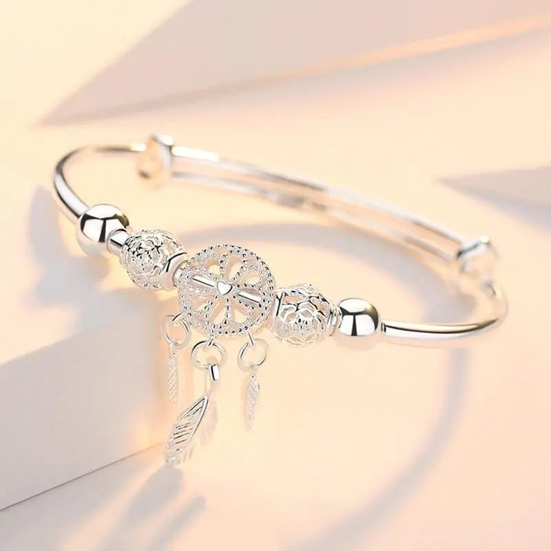 Pulsera de plata con dije atrapasueños