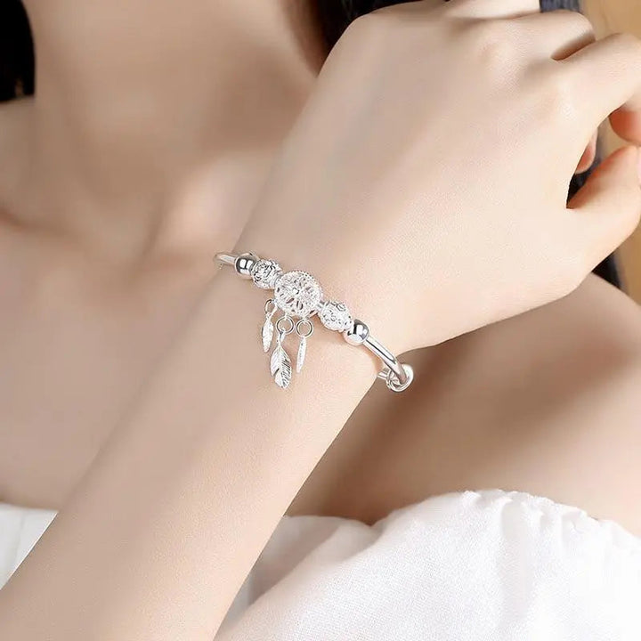 Pulsera de plata con dije atrapasueños